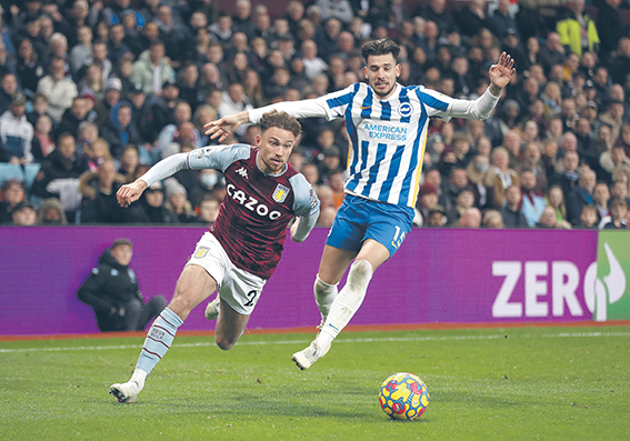 Aston Villa's Matty Cash (left) and Brighton and Hove Albion's Jakub Moder (right) battle for the ball during the Premier League match at Villa Park, Birmingham. Picture date: Saturday November 20, 2021.,Image: 644105289, License: Rights-managed, Restrictions: EDITORIAL USE ONLY No use with unauthorised audio, video, data, fixture lists, club/league logos or "live" services. Online in-match use limited to 120 images, no video emulation. No use in betting, games or single club/league/player publications., Model Release: no, Credit line: Bradley Collyer / PA Images / Forum