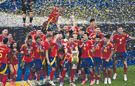 Soccer Football - Euro 2024 - Final - Spain v England - Berlin Olympiastadion, Berlin, Germany - July 14, 2024 Spain's Alvaro Morata lifts the trophy as he celebrates with teammates after winning Euro 2024,Image: 889720741, License: Rights-managed, Restrictions: , Model Release: no, Credit line: Angelika Warmuth / Reuters / Forum