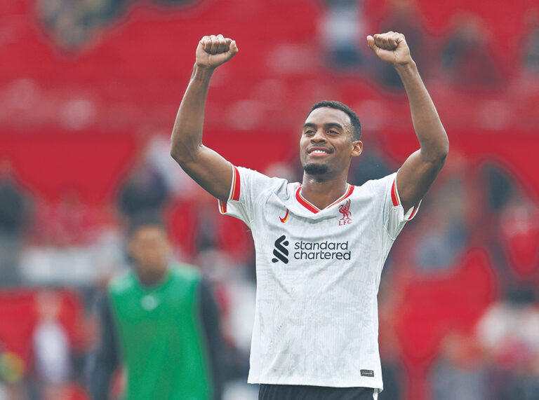 Soccer Football - Premier League - Manchester United v Liverpool - Old Trafford, Manchester, Britain - September 1, 2024 Liverpool's Ryan Gravenberch celebrates after the match  EDITORIAL USE ONLY. NO USE WITH UNAUTHORIZED AUDIO, VIDEO, DATA, FIXTURE LISTS, CLUB/LEAGUE LOGOS OR 'LIVE' SERVICES. ONLINE IN-MATCH USE LIMITED TO 120 IMAGES, NO VIDEO EMULATION. NO USE IN BETTING, GAMES OR SINGLE CLUB/LEAGUE/PLAYER PUBLICATIONS. PLEASE CONTACT YOUR ACCOUNT REPRESENTATIVE FOR FURTHER DETAILS..,Image: 903823607, License: Rights-managed, Restrictions: NO USE WITH UNAUTHORIZED AUDIO, VIDEO, DATA, FIXTURE LISTS, CLUB/LEAGUE LOGOS OR “LIVE” SERVICES. ONLINE IN-MATCH USE LIMITED TO 45 IMAGES, NO VIDEO EMULATION. NO USE IN BETTING, GAMES OR SINGLE CLUB/LEAGUE/PLAYER PUBLICATIONS., Model Release: no, Credit line: Molly Darlington / Reuters / Forum