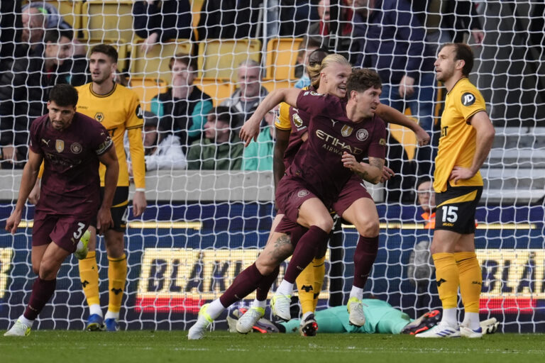 Manchester City's John Stones (centre, right) celebrates scoring their side's second goal of the game during the Premier League match at Molineux Stadium, Wolverhampton. Picture date: Sunday October 20, 2024.,Image: 923970048, License: Rights-managed, Restrictions: EDITORIAL USE ONLY No use with unauthorised audio, video, data, fixture lists, club/league logos or "live" services. Online in-match use limited to 120 images, no video emulation. No use in betting, games or single club/league/player publications., Model Release: no, Credit line: Nick Potts / PA Images / Forum