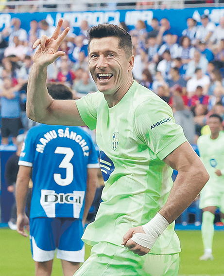 Soccer Football - LaLiga - Deportivo Alaves v FC Barcelona - Estadio Mendizorroza, Vitoria-Gasteiz, Spain - October 6, 2024 FC Barcelona's Robert Lewandowski celebrates scoring their third goal to complete his hat-trick   REFILE - CORRECTING CAPTION,Image: 917240613, License: Rights-managed, Restrictions: , Model Release: no, Credit line: Vincent West / Reuters / Forum