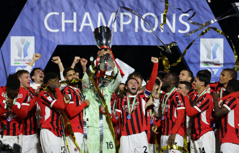 Soccer Football - Italian Super Cup - Final - Inter Milan v AC Milan - Al Awwal Park, Riyadh, Saudi Arabia - January 7, 2025 AC Milan's Mike Maignan lifts the trophy as he celebrates with teammates after winning the Italian Super Cup,Image: 952137671, License: Rights-managed, Restrictions: , Model Release: no, Credit line: Claudia Greco / Reuters / Forum